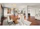 Open concept dining room featuring wood floors, modern lighting, neutral walls and clear sightlines to the kitchen at 2148 Allgood Rd, Marietta, GA 30062