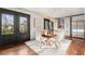 Bright dining area features hardwood floors, modern lighting, built-in cabinets and french door access to the backyard at 2148 Allgood Rd, Marietta, GA 30062