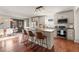 Charming kitchen featuring stainless steel appliances, an island with barstool seating, and wood floors at 2148 Allgood Rd, Marietta, GA 30062