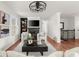 Cozy living room with a fireplace, hardwood floors, and decorative shelving creating a tranquil living space at 2148 Allgood Rd, Marietta, GA 30062