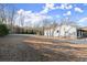 The gravel side yard offers practicality with a house and deck features, and minimal upkeep at 2148 Allgood Rd, Marietta, GA 30062