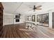 Inviting sun room with fireplace and wooden floors, seamlessly connecting indoor and outdoor spaces at 2148 Allgood Rd, Marietta, GA 30062