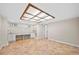 Open room featuring built in shelving, a light panel and terra cotta tile flooring at 2151 Zelda Ne Dr, Atlanta, GA 30345