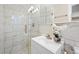 Modern bathroom featuring marble tiles, glass shower enclosure and a stylish vanity at 2151 Zelda Ne Dr, Atlanta, GA 30345