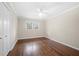 Classic bedroom showcasing hardwood floors, a ceiling fan, and a closet at 2151 Zelda Ne Dr, Atlanta, GA 30345
