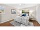 Well-lit bedroom with hardwood floors, ceiling fan, and ample natural light at 2151 Zelda Ne Dr, Atlanta, GA 30345
