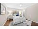 Comfortable bedroom featuring hardwood floors, a ceiling fan, and a closet at 2151 Zelda Ne Dr, Atlanta, GA 30345