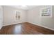 Bright bedroom featuring gleaming hardwood floors and neutral wall color at 2151 Zelda Ne Dr, Atlanta, GA 30345
