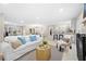 Bright living room features an open layout, white sofa, and stylish decor at 2151 Zelda Ne Dr, Atlanta, GA 30345