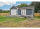 Exterior view of backyard with a new shed/workshop and fenced in yard at 598 Taylor Se Dr, Smyrna, GA 30080