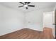 Bedroom with ceiling fan, modern flooring, and access to the bathroom; ready for furnishings at 598 Taylor Se Dr, Smyrna, GA 30080