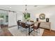 Elegant dining room with modern chandelier and sliding barn door, ideal for Gathering gatherings at 598 Taylor Se Dr, Smyrna, GA 30080