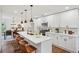 Modern kitchen features quartz countertops, a large island, and stainless steel appliances at 598 Taylor Se Dr, Smyrna, GA 30080