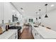 Stylish modern kitchen with long quartz countertops, stainless appliances, and abundant cabinet space at 598 Taylor Se Dr, Smyrna, GA 30080