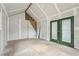 Interior view of workshop, showing unfinished drywall, a work table and a set of french doors at 598 Taylor Se Dr, Smyrna, GA 30080