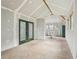 Interior view of workshop, showing unfinished drywall, a work table and a set of french doors at 598 Taylor Se Dr, Smyrna, GA 30080