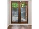 Stylish back door with glass panels and dark wood trim leading to an outdoor patio at 101 Swanton Hill Ct, Decatur, GA 30030