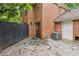 Backyard with stone pavers, a door, and a black fence at 101 Swanton Hill Ct, Decatur, GA 30030