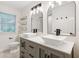 Bright bathroom featuring a modern vanity, dual sinks, and updated fixtures at 101 Swanton Hill Ct, Decatur, GA 30030