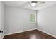 Cozy bedroom with hardwood floors, neutral walls, and a ceiling fan at 101 Swanton Hill Ct, Decatur, GA 30030