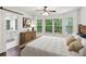 Staged bedroom with hardwood floors, three windows and en-suite bath at 101 Swanton Hill Ct, Decatur, GA 30030