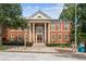 Classic brick building with stately columns, symmetrical windows, and an American flag displayed at 101 Swanton Hill Ct, Decatur, GA 30030