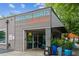 Modern coffee shop with corrugated metal siding and stylish planters outside Dancing Goats Coffee Bar at 101 Swanton Hill Ct, Decatur, GA 30030