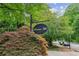 Decorative Swanton Hill neighborhood sign surrounded by lush landscaping and street views at 101 Swanton Hill Ct, Decatur, GA 30030