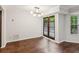 Dining area featuring hardwood floors, French doors, modern light fixture, and a view of the backyard at 101 Swanton Hill Ct, Decatur, GA 30030
