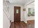 Inviting foyer with hardwood floors, staircase, and a view of a cozy window seat at 101 Swanton Hill Ct, Decatur, GA 30030