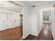Open hallway with hardwood floors and neutral paint, leading to additional rooms at 101 Swanton Hill Ct, Decatur, GA 30030