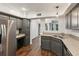 Spacious kitchen with stainless steel fridge, granite countertops, and dark wood cabinets at 101 Swanton Hill Ct, Decatur, GA 30030