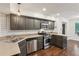 Updated kitchen with stainless steel appliances, granite countertops, and modern backsplash at 101 Swanton Hill Ct, Decatur, GA 30030