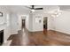 Open-concept living room featuring hardwood floors, fireplace, and modern lighting fixtures at 101 Swanton Hill Ct, Decatur, GA 30030