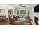 Bright living room with hardwood floors, fireplace, bay window, and modern furnishings at 101 Swanton Hill Ct, Decatur, GA 30030