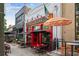 Exterior view of O'Sullivans, featuring patio seating and umbrellas at 101 Swanton Hill Ct, Decatur, GA 30030