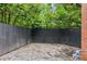 Enclosed patio featuring stone pavers and mature trees overhead at 101 Swanton Hill Ct, Decatur, GA 30030