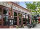 The Jamón Ibérico Restaurant shows curb appeal with its rustic brick facade and street-side tables at 101 Swanton Hill Ct, Decatur, GA 30030