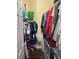 Walk-in closet featuring a double row of clothing, shelves and flooring at 1360 Raven Rock Nw Trl, Kennesaw, GA 30152