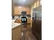 Bright kitchen with stainless steel appliances and hardwood floors at 1360 Raven Rock Nw Trl, Kennesaw, GA 30152