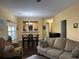 The living room features hardwood floors and a beautiful yellow paint at 1360 Raven Rock Nw Trl, Kennesaw, GA 30152