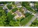 Aerial real estate image of the property in a lush, green neighborhood at 150 South St, Buford, GA 30518
