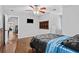 This bedroom has hardwood flooring, a ceiling fan, and a window box to display your favorite things at 150 South St, Buford, GA 30518