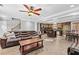 Bright living area with tile floors seamlessly connecting to a dining area and kitchen at 150 South St, Buford, GA 30518