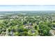 Aerial real estate shot showcases a peaceful neighborhood with lush tree coverage at 150 South St, Buford, GA 30518