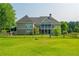 Spacious fenced backyard showcasing a well-maintained lawn and the home's rear architecture at 815 Spring View Ct, Covington, GA 30014
