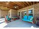 Charming covered patio with brick columns and inviting swing seat at 815 Spring View Ct, Covington, GA 30014