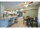 Open concept kitchen and eating area featuring tile floors and stone countertops at 815 Spring View Ct, Covington, GA 30014