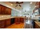 Charming kitchen featuring granite countertops, a tile backsplash, and dark wood cabinets at 815 Spring View Ct, Covington, GA 30014