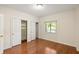 Bright bedroom features hardwood floors and double door closet at 1800 Clairmont Lk # 216, Decatur, GA 30033